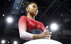 Sunisa Lee of the U.S. prepares her hands at the floor during women's team final at the Gymnastics World Championships in Stuttgart, Germany, Tuesday,