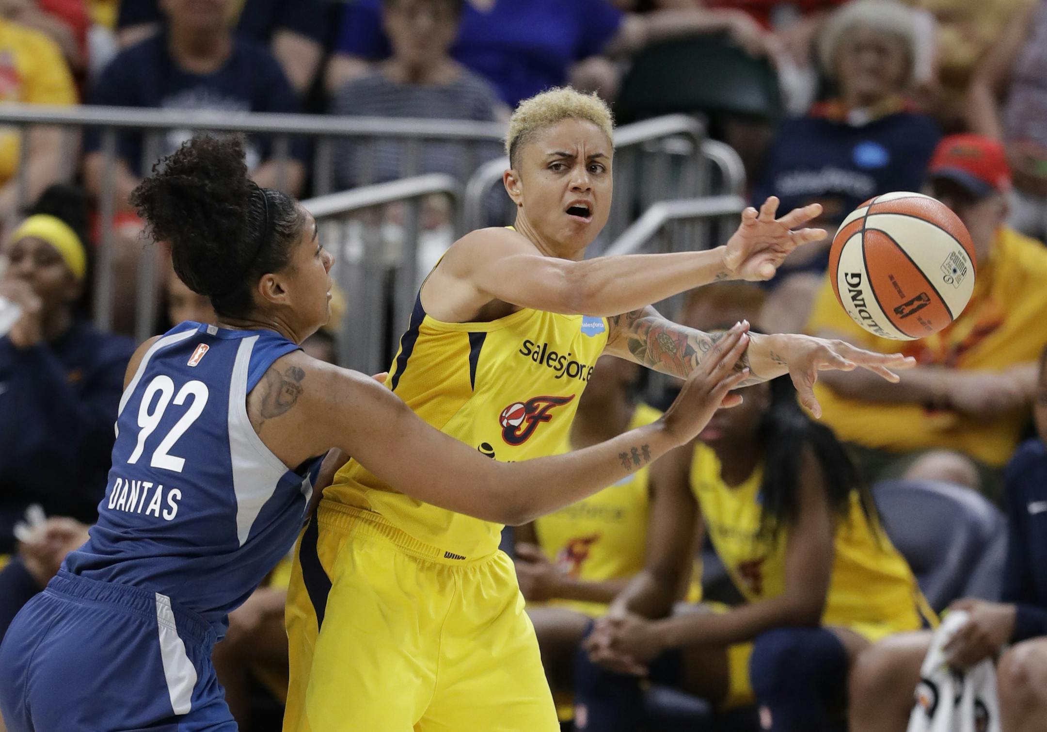 Indiana Fever's Candice Dupree (4) passes against Minnesota Lynx's Damiris Dantas (92) during the first half of a WNBA basketball game, Tuesday, June 25, 2019, in Indianapolis. (AP Photo/Darron Cummings)