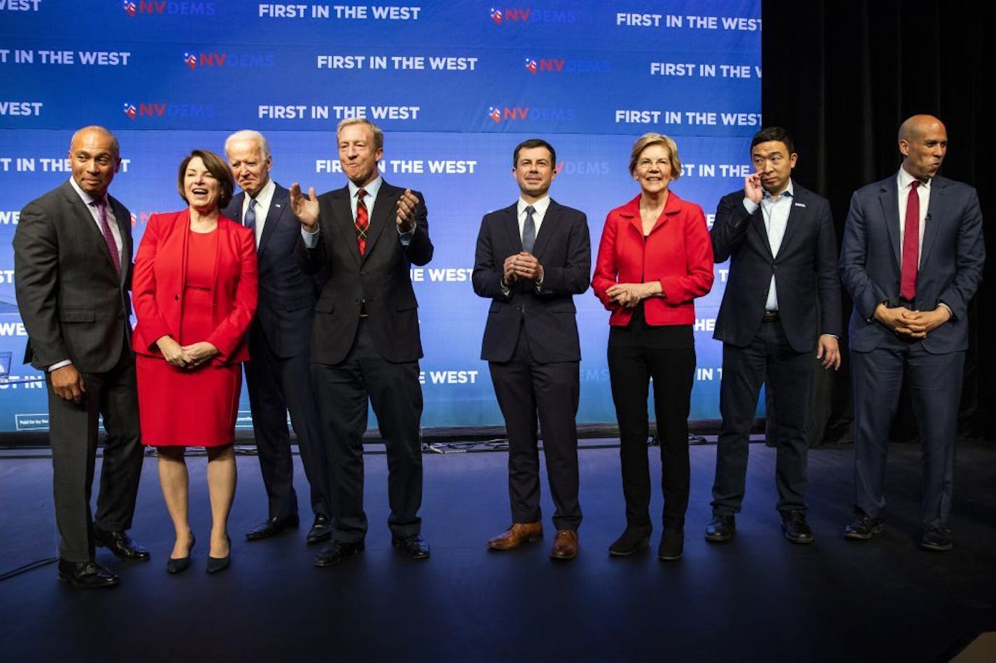 FILE -- Democratic presidential candidates gather onstage for a state Democratic party forum in Las Vegas on Nov. 17, 2019. From left: former Massachusetts Gov. Deval Patrick; Sen. Amy Klobuchar (D-Minn.); former Vice President Joe Biden; Tom Steyer; Mayor Pete Buttigieg of South Bend, Ind.; Sen. Elizabeth Warren (D-Mass.); Andrew Yang; and Sen. Cory Booker (D-N.J.).