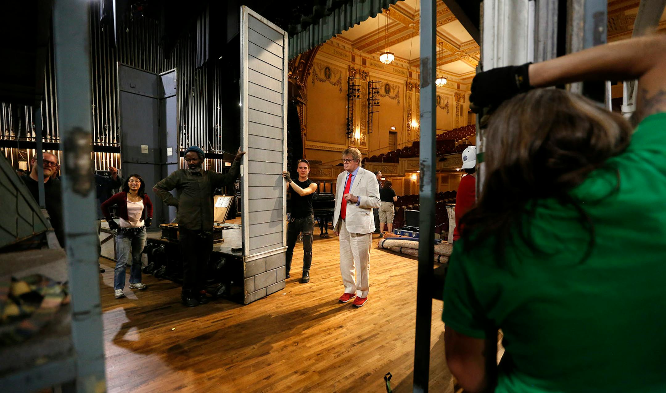 Garrison Keillor watches as the set for "A Prairie Home Companion" is taken down after the show at the State Theatre.