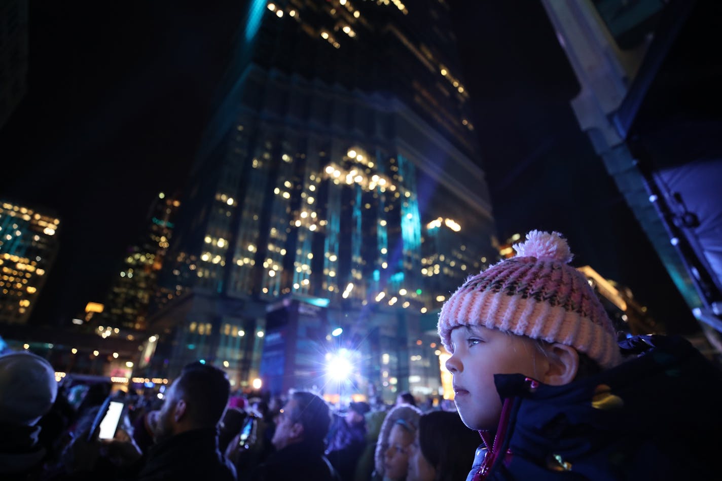 Cora Schmidt 3, sat on the shoulders of Katie Vaughn as she listened to Inina Menze sing Let it go, from the movie Frozen at the Super Bowl Live kickoff show on the Nicollet Mall Friday January 27, 2017 in Minneapolis, MN