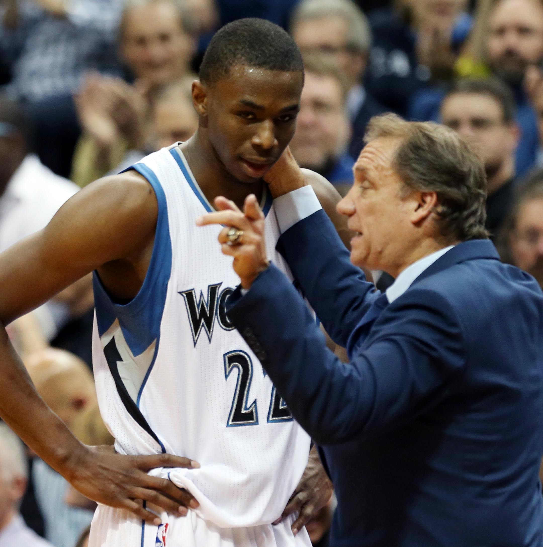 Minnesota Timberwolves head coach Flip Saunders gives pointers to rookie Andrew Wiggins as he headed to the bench in the second half of an NBA basketball game, Thursday, Oct. 30, 2014, in Minneapolis. The Timberwolves won 97-91. (AP Photo/Jim Mone) ORG XMIT: MIN2014110420594384