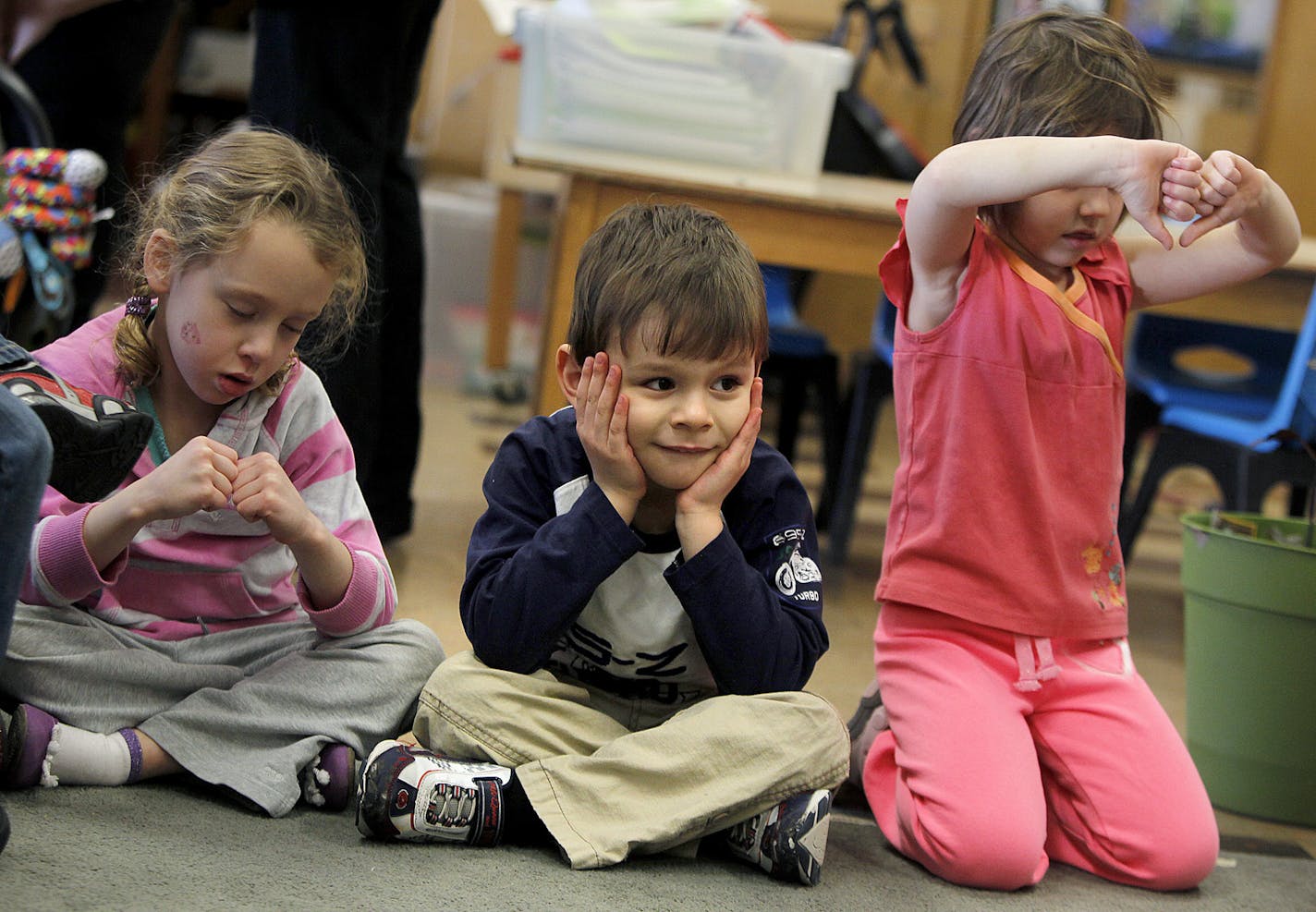 Jimmy Oscar Baca Tallen, 4, sat quietly as his classmates learned how to make a heart out of their hands at St. Paul's Childhood Center Tuesday, February 19, 2013. (ELIZABETH FLORES/STAR TRIBUNE) ELIZABETH FLORES &#x2022; eflores@startribune.com