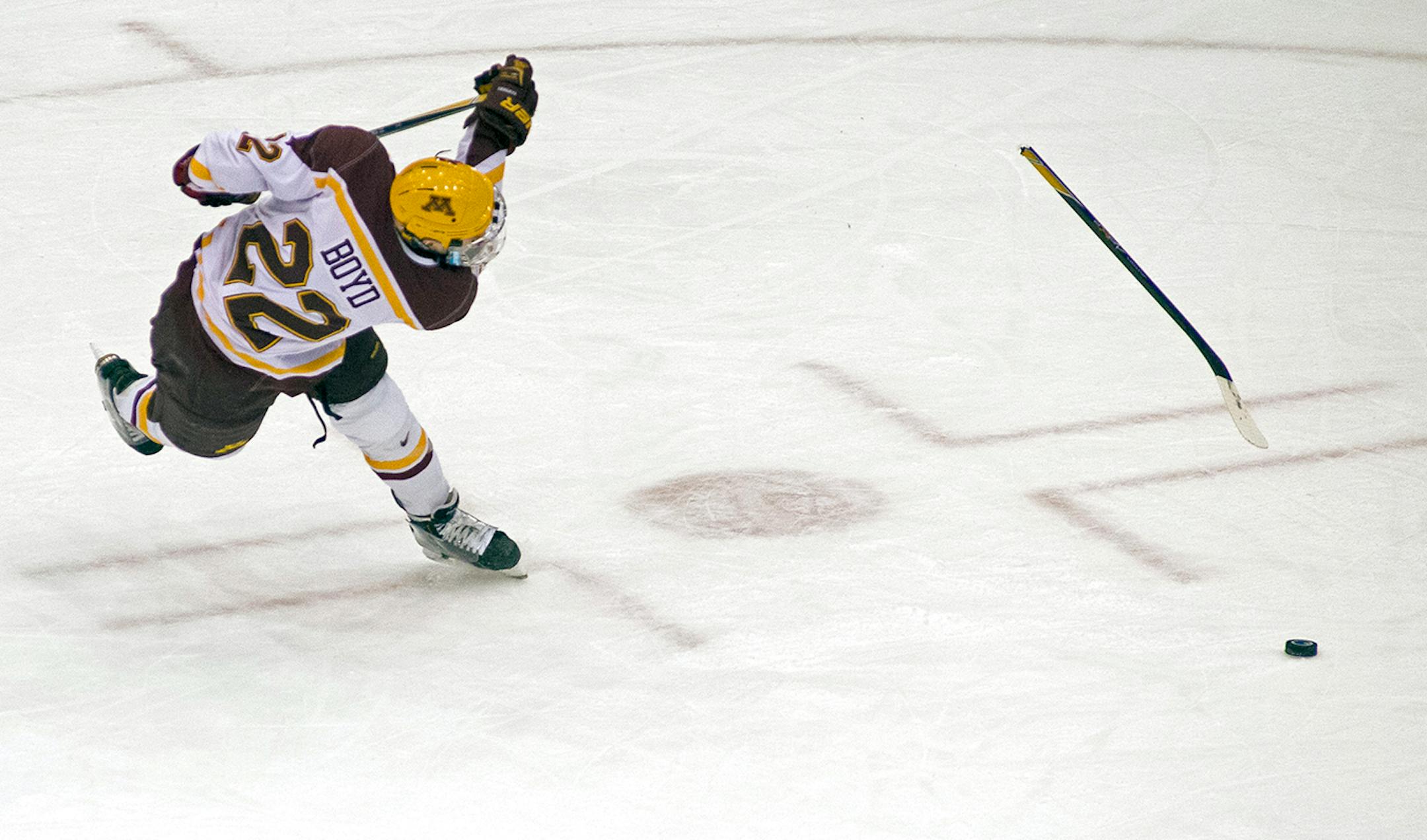 The stick of University of Minnesota center Travis Boyd (22) breaks as he attempts a snapshot against Wisconsin in the first period. ] (Aaron Lavinsky | StarTribune) The University of Minnesota Gophers hockey team plays against the Wisconsin Badgers on Friday, Jan. 16, 2015 at Mariucci Arena.