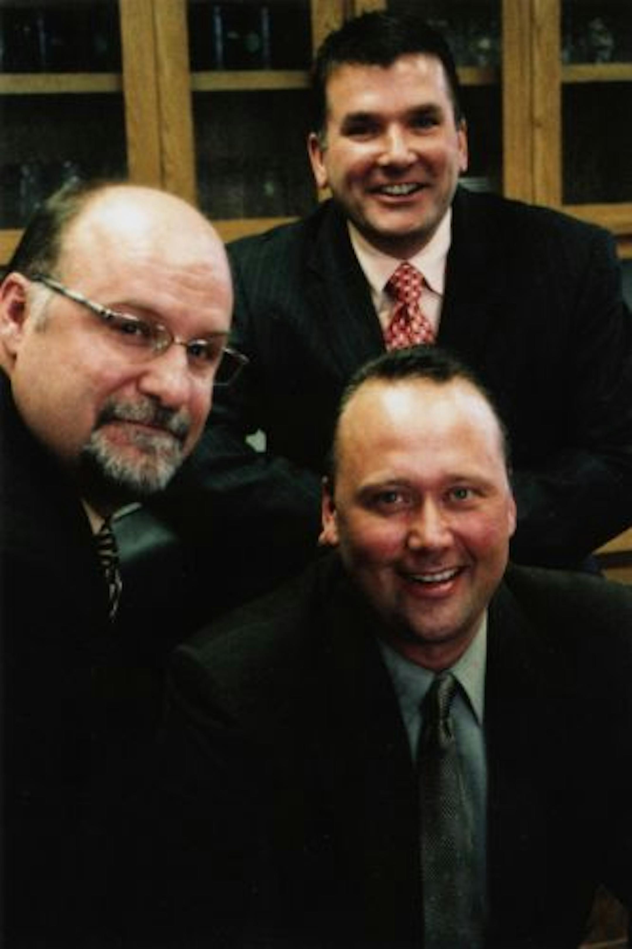 The new owners of Bay West Inc. tripled the company's revenue in their first three years. They are Ed Bacig, left, Gene Kuppenbender, at back, and Lon Larson.