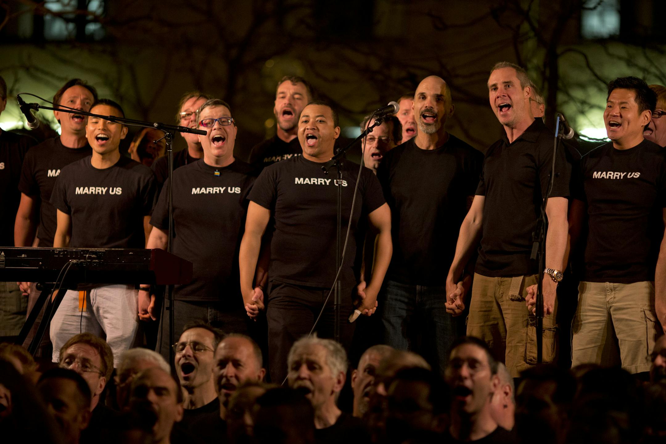 The City of St. Paul hosted a "Love is the Law" outdoor musical celebration Tuesday evening, May 14, 2013 to commemorate the signing of the historic marriage bill. The party culminated in the appearance by The Suburbs, whose song, "Love is the Law" became the anthem of the same-sex marriage movement in the state. The Twin Cities Gay Men's Chorus performed just before The Suburbs Tuesday night. ] JEFF WHEELER ‚Ä¢ jeff.wheeler@startribune.com ORG XMIT: MIN1305150014380281