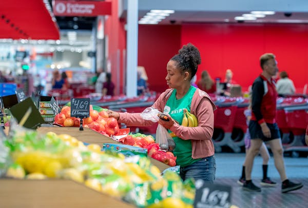 A Shipt “shopper,” an independent contractor who fulfills orders, picks out food at Target.