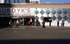 A line of socially distant customers formed outside of Surdyk's in Minneapolis last Friday as the store limited how many customers could be inside at 