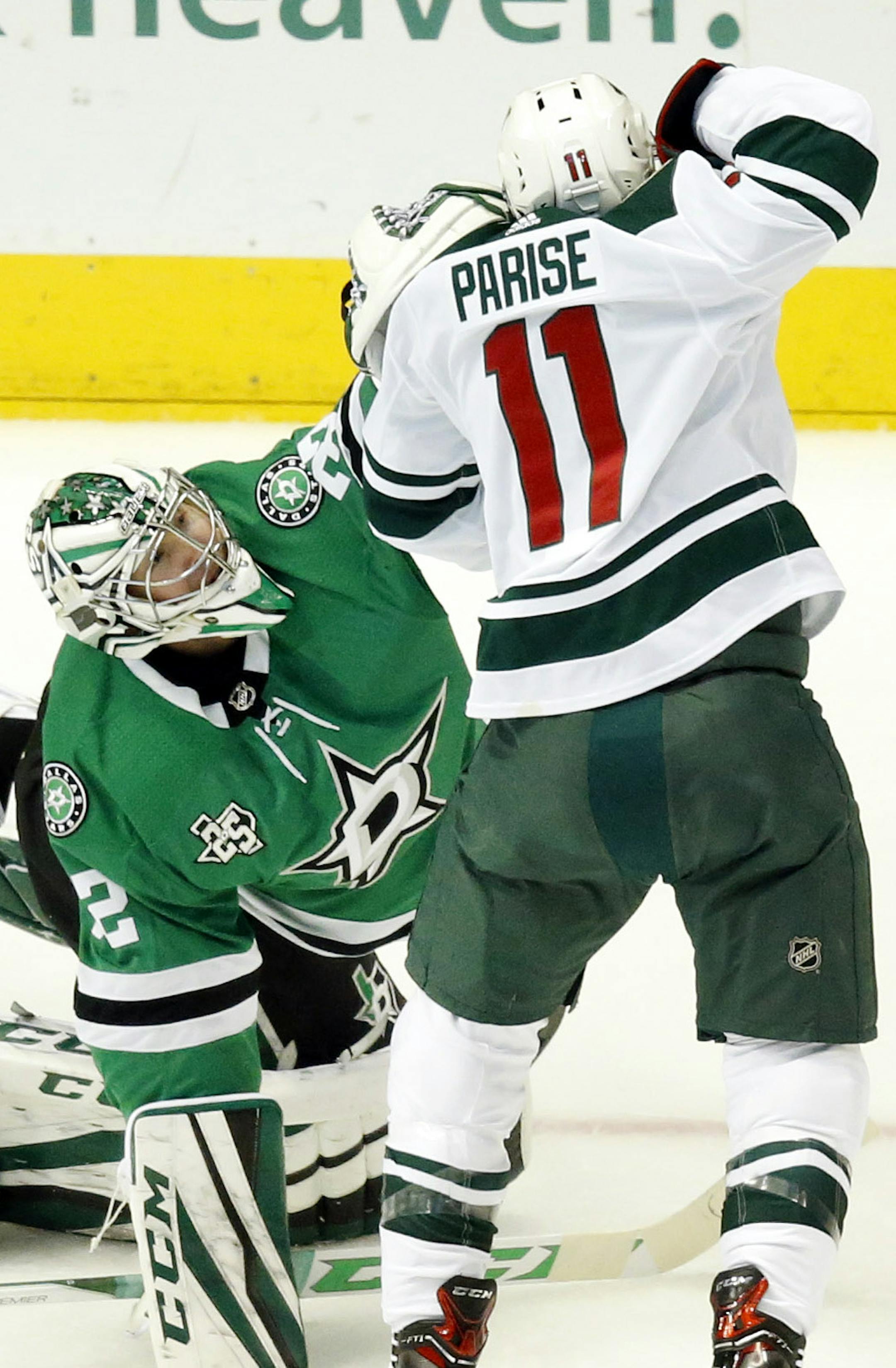 Dallas Stars goaltender Kari Lehtonen (32) gives a shot to the Minnesota Wild's Zach Parise (11) during the first period at the American Airlines Center in Dallas on Saturday, Feb. 3, 2018. The Stars won, 6-1. (Tom Fox/Dallas Morning News/TNS)