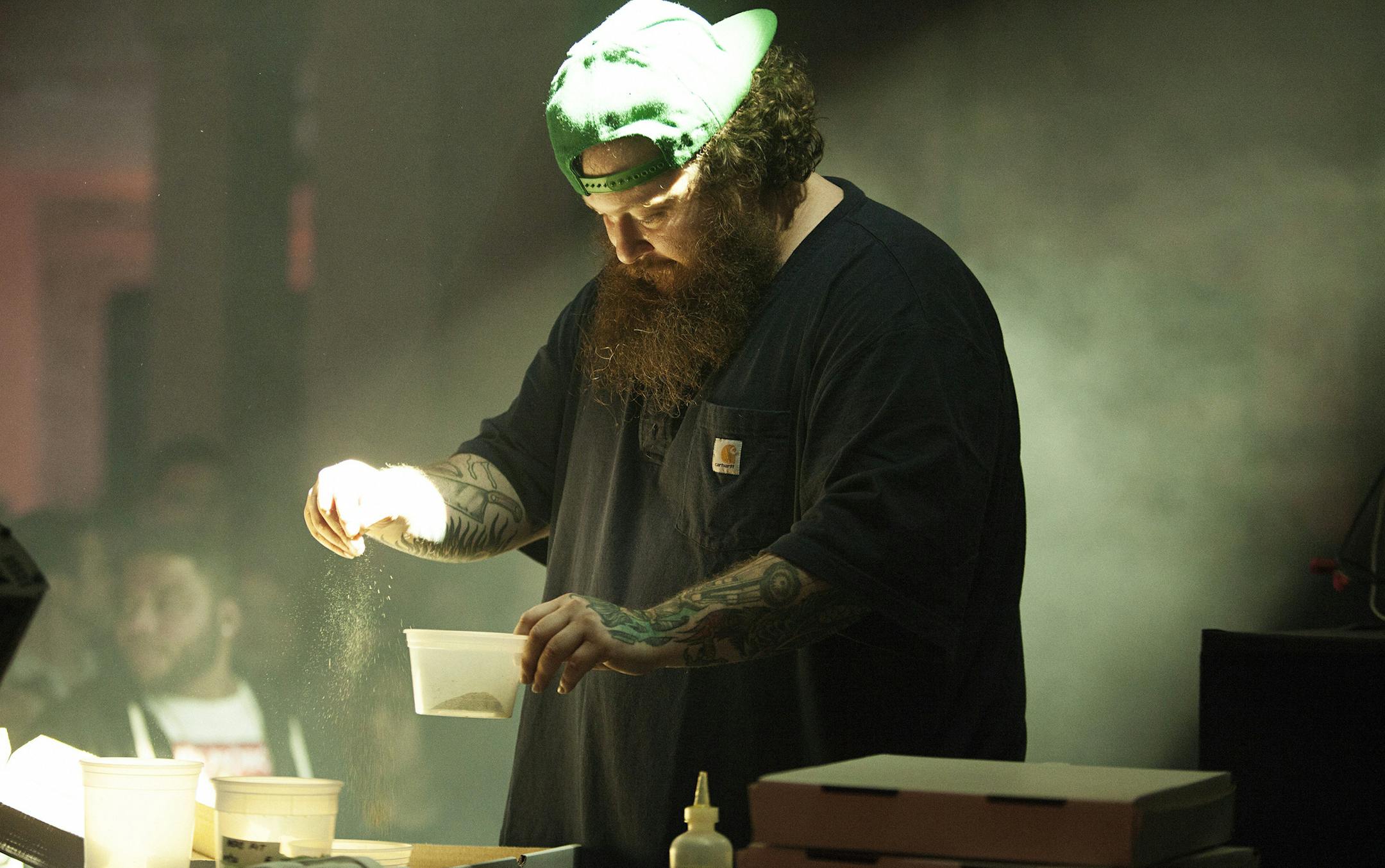 Action Bronson, rapper and a host of a Vice show, makes a pizza while performing at the NewFronts event in New York, May 1, 2015. Even as cash flows freely in Viceís direction, the company is trying to keep its brash, insurgent image. (Jesse Dittmar/The New York Times)