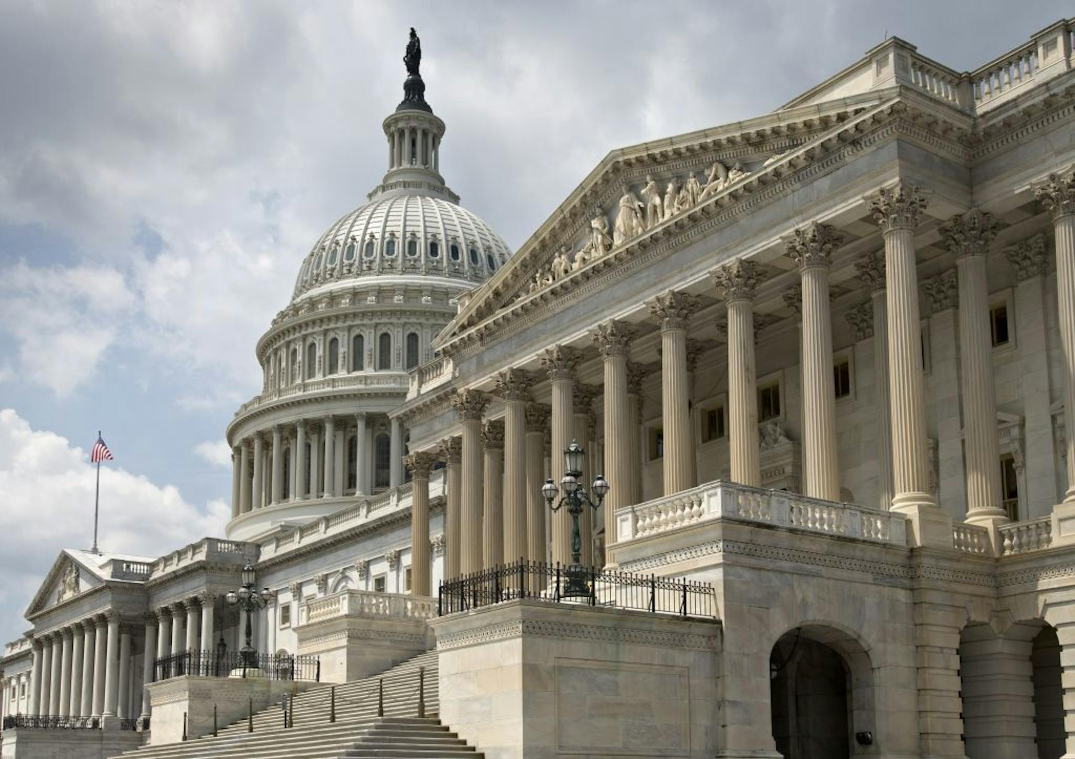 The U.S. Capitol, with the Senate at right and the House of Representatives at far left, is seen in Washington, Monday, June 17, 2013. Congress works this week on immigration reform, a farm bill, and continues to investigate controversies with the Internal Revenue Service and the National Security Agency.