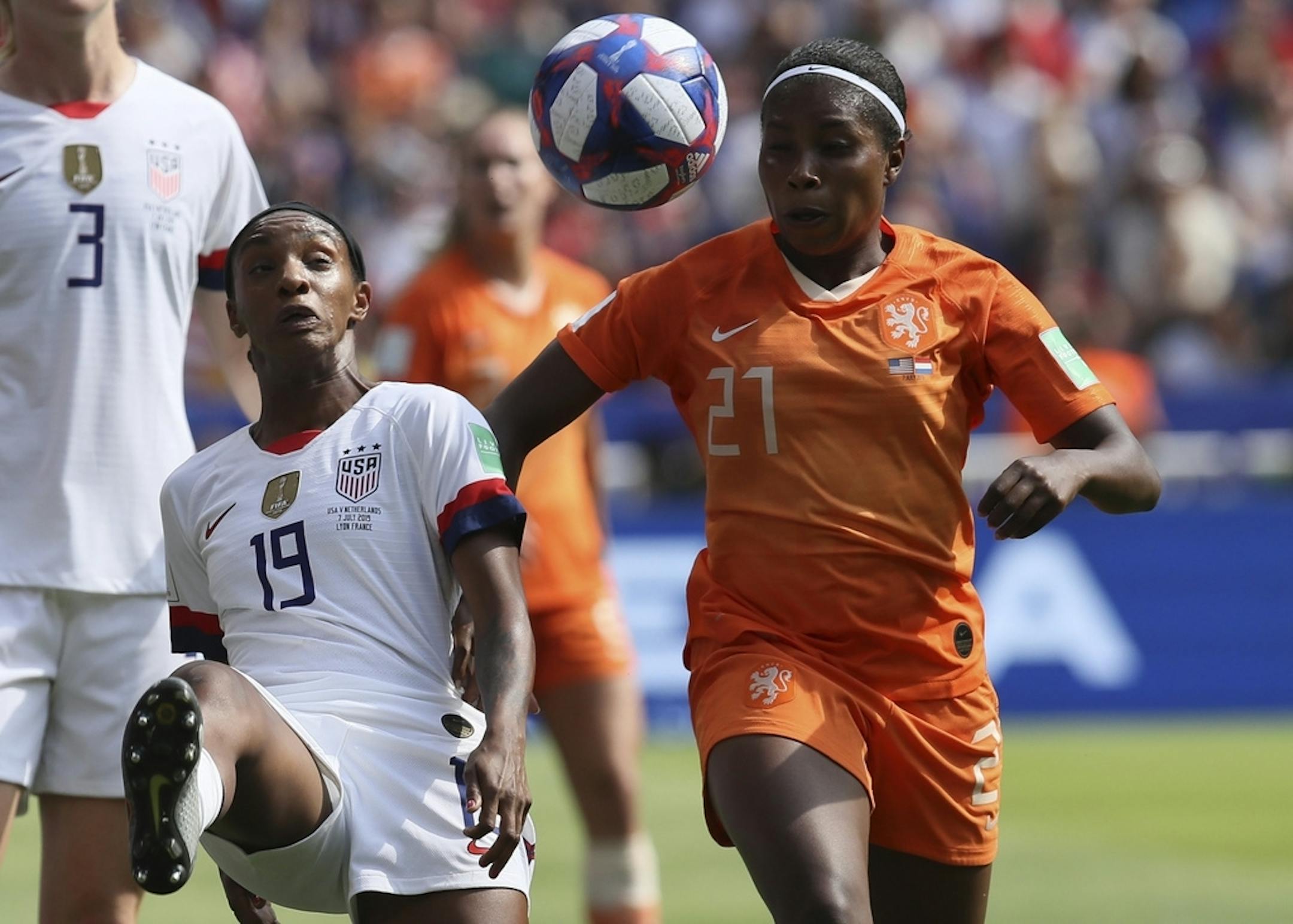United States' Crystal Dunn, left, is challenged by Netherlands' Lineth Beerensteyn during the Women's World Cup final soccer match between US and The Netherlands at the Stade de Lyon in Decines, outside Lyon, France, Sunday, July 7, 2019.