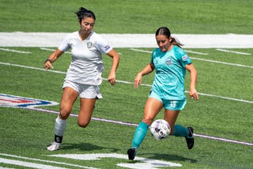 Minnesota Aurora forward Maya Hansen (right)