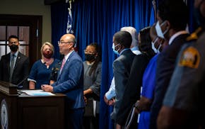 Ramsey County Attorney John Choi, joined by county and St. Paul city leaders, at a news conference Wednesday, Sept. 8, 2021. Choi announced the end of