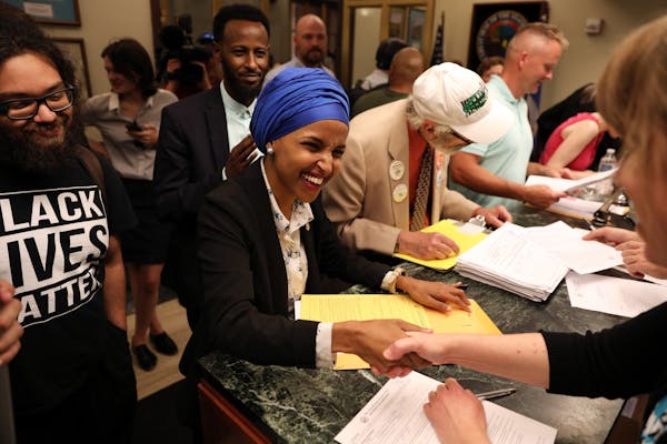 State Rep. Ilhan Omar, shown filing to run for the congressional seat that Rep. Keith Ellison is leaving, got backing from Gov. Mark Dayton on Friday.