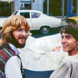 photo of two men in the '70s looking at a map