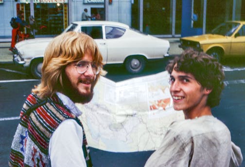 photo of two men in the '70s looking at a map