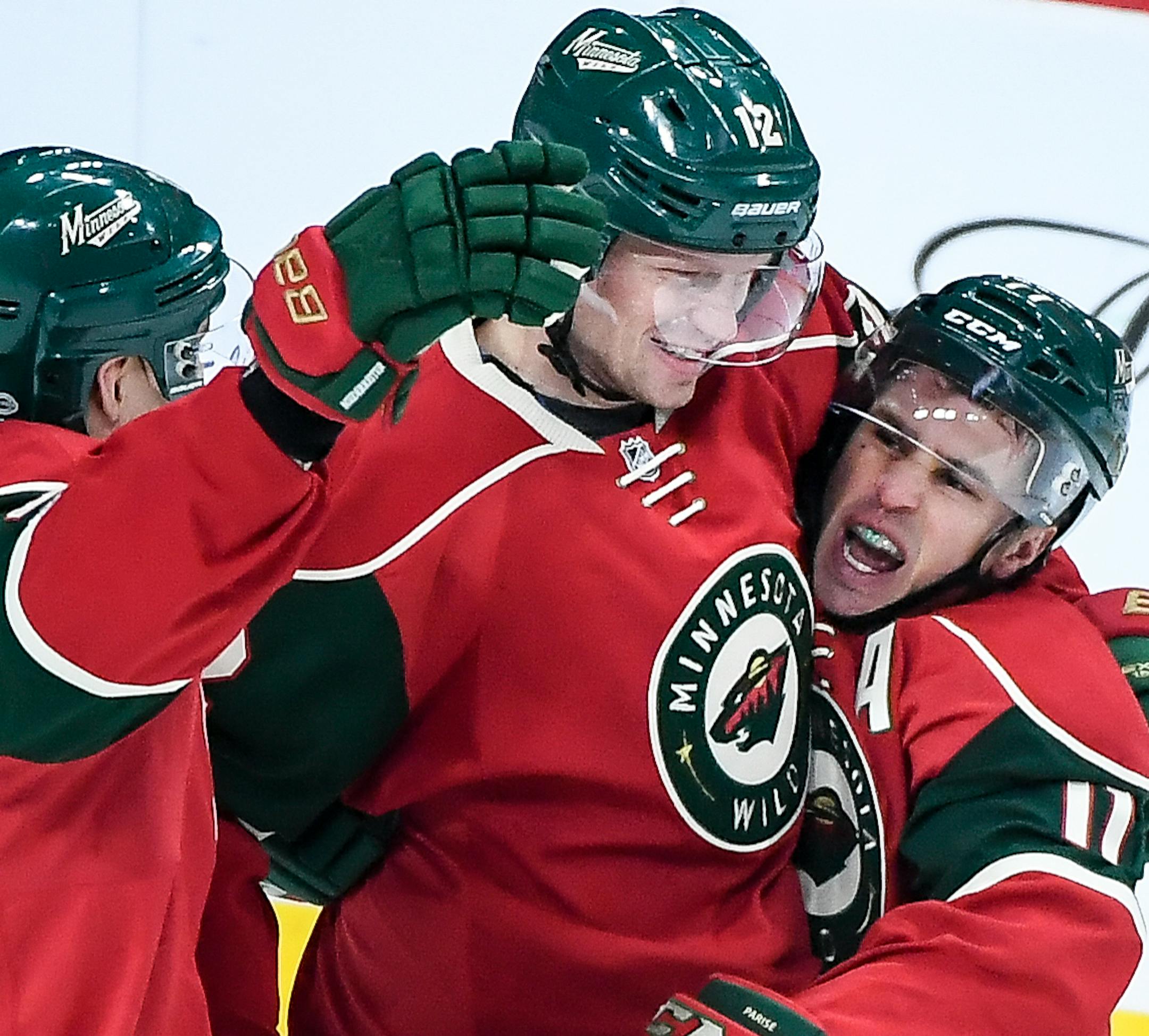 Wild players, including right wing Nino Niederreiter (22) and center Eric Staal (12), celebrated a goal by left wing Zach Parise (11) in the first period against the Carolina Hurricanes. ] AARON LAVINSKY ï aaron.lavinsky@startribune.com The Minnesota Wild played the Carolina Hurricanes on Tuesday, April 4th, 2017 at Xcel Energy Center in St. Paul, Minn.