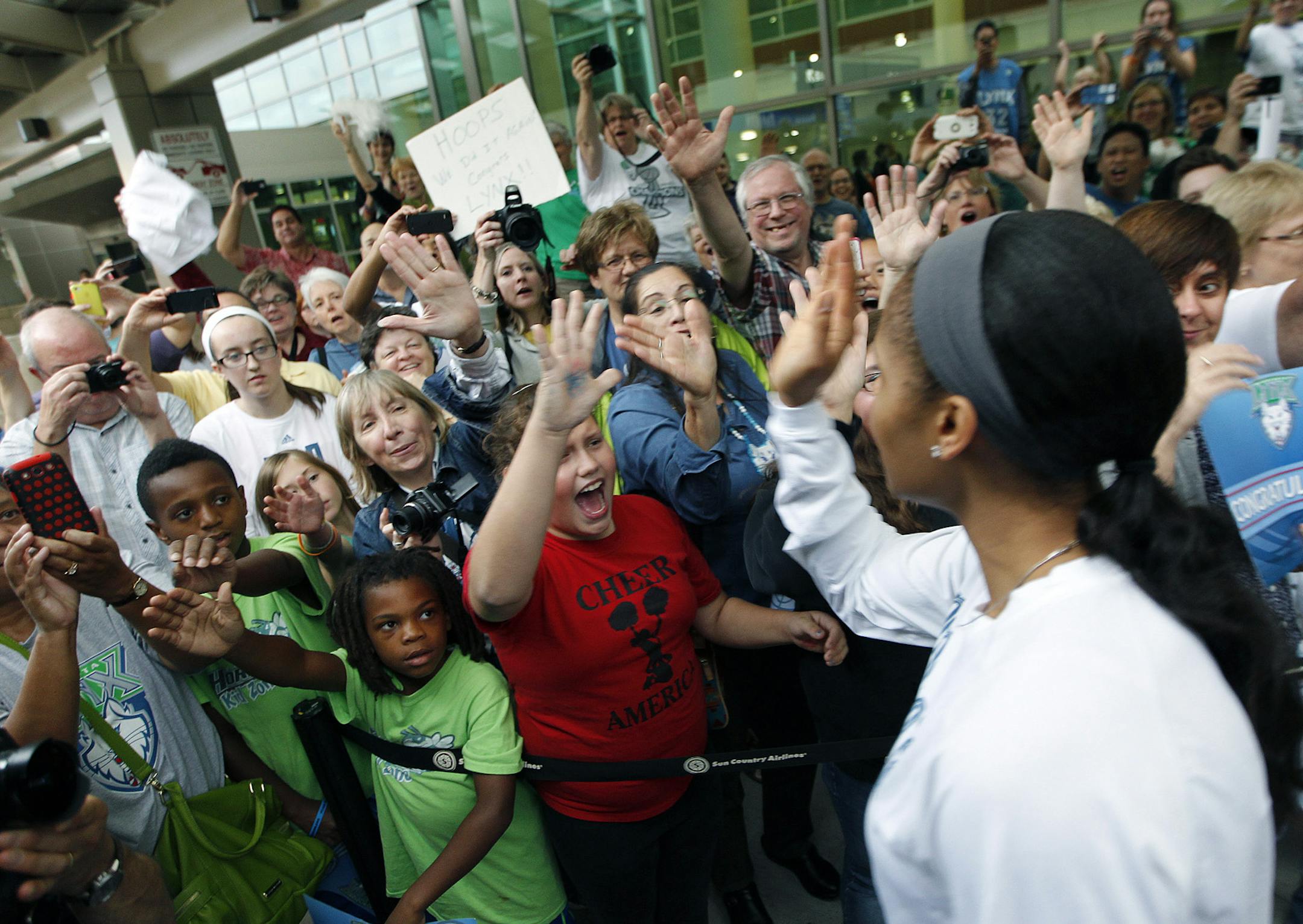 Minnesota Lynx Maya Moore was welcomed by fans upon their arrival at the Humphrey Terminal, Friday, October 11, 2012 in Bloomington, MN. The Minnesota Lynx won their second WNBA title in three years beating the Atlanta Dream 86-77 on Thursday. (ELIZABETH FLORES/STAR TRIBUNE) ELIZABETH FLORES • eflores@startribune.com