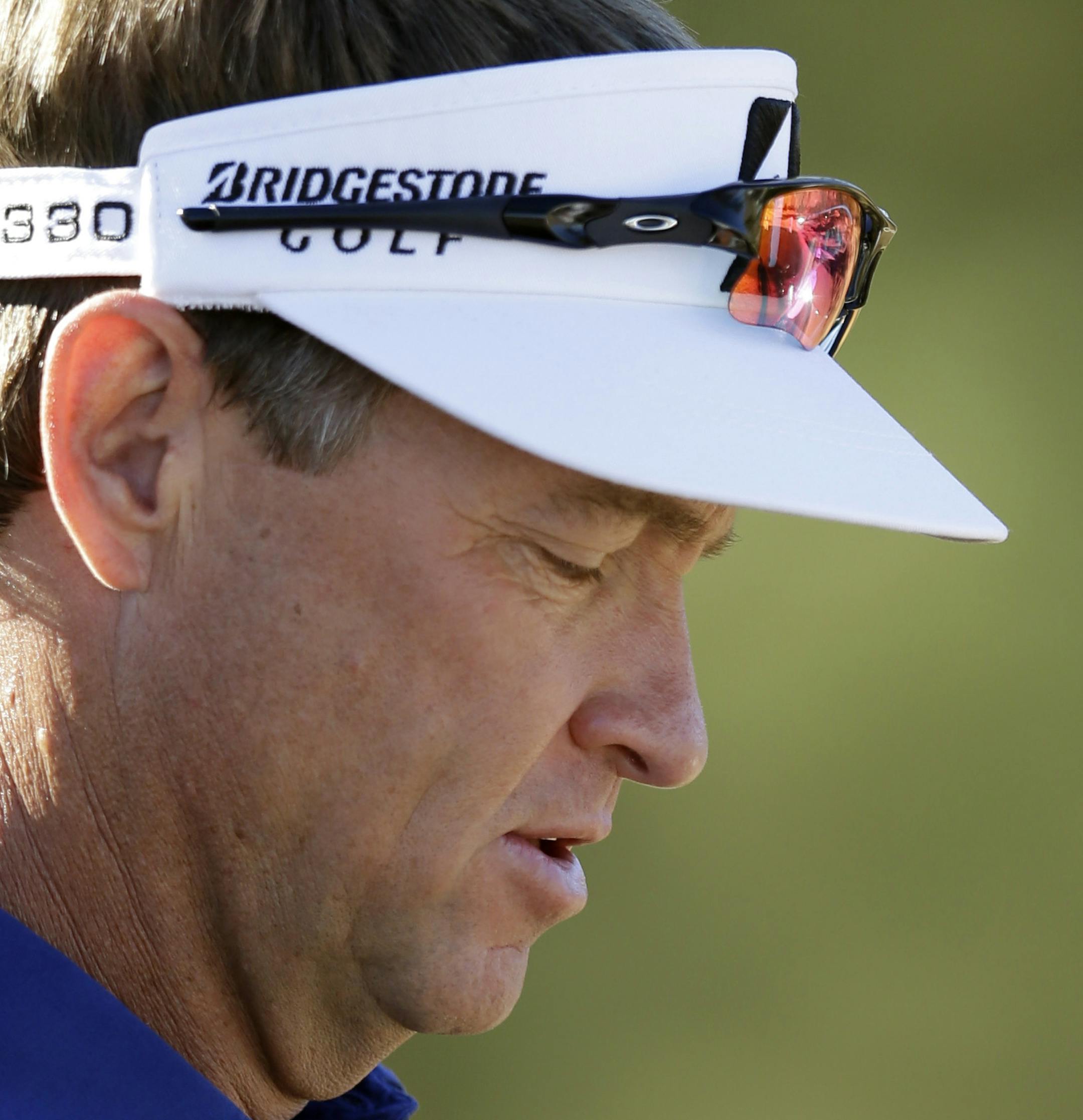 Davis Love III signs golf balls during the third round of the Humana Challenge golf tournament on the Nicklaus Private Course at PGA West Saturday, Jan. 19, 2013, in La Quinta, Calif. (AP Photo/Ben Margot) ORG XMIT: CABM107