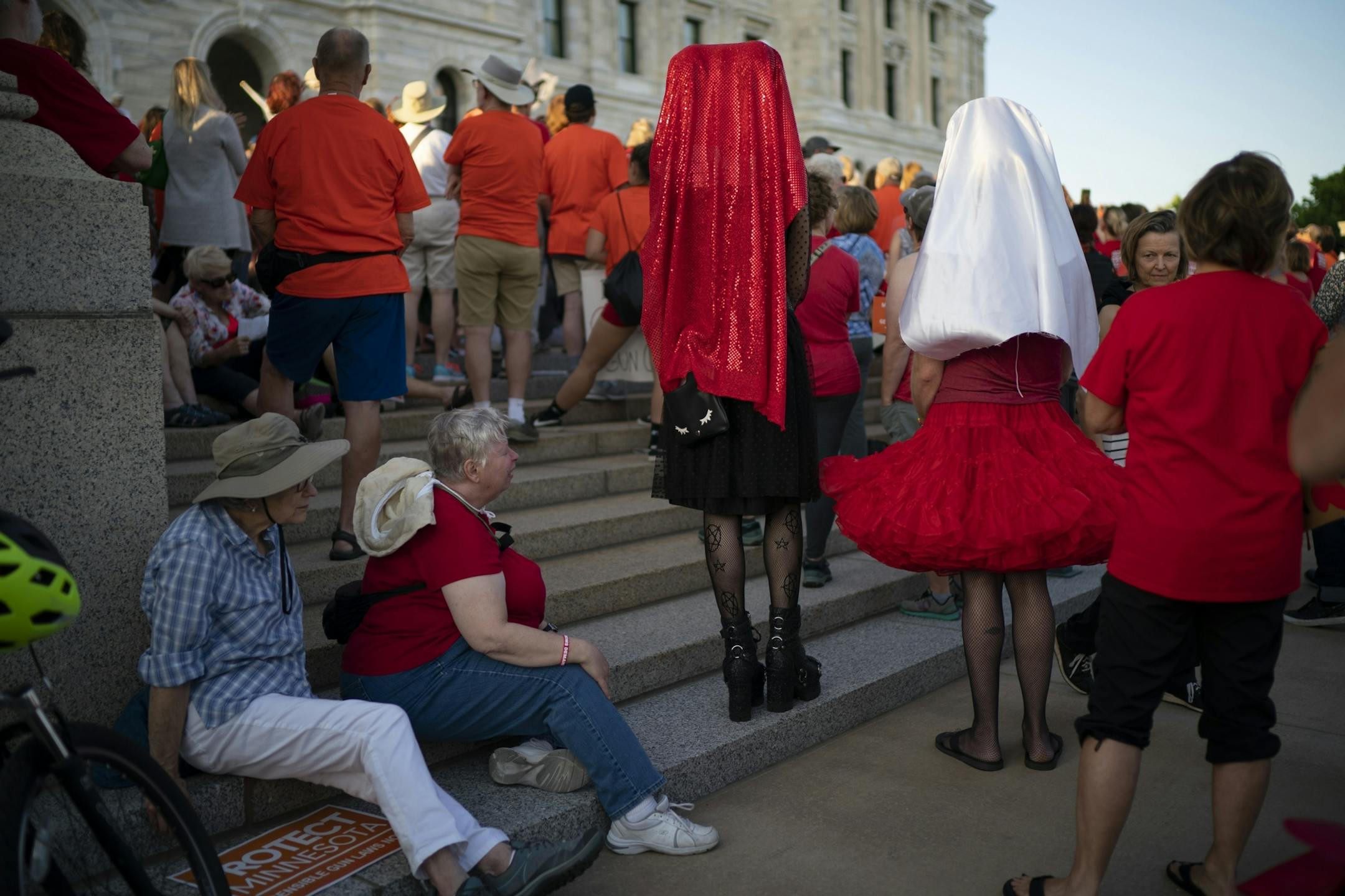 Attendees listened to speakers on the steps of the State Capitol. More than 1,000 people were at the rally Wednesday night.