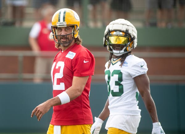 Packers quarterback Aaron Rodgers, left,and running back Aaron Jones lost two top receivers in the offseason.