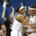 Lynx Seimone Augustus and Rebekkah Brunson celebrated with teammate Maya Moore after she blocked the shot of the Storm's Katie Smith during the second