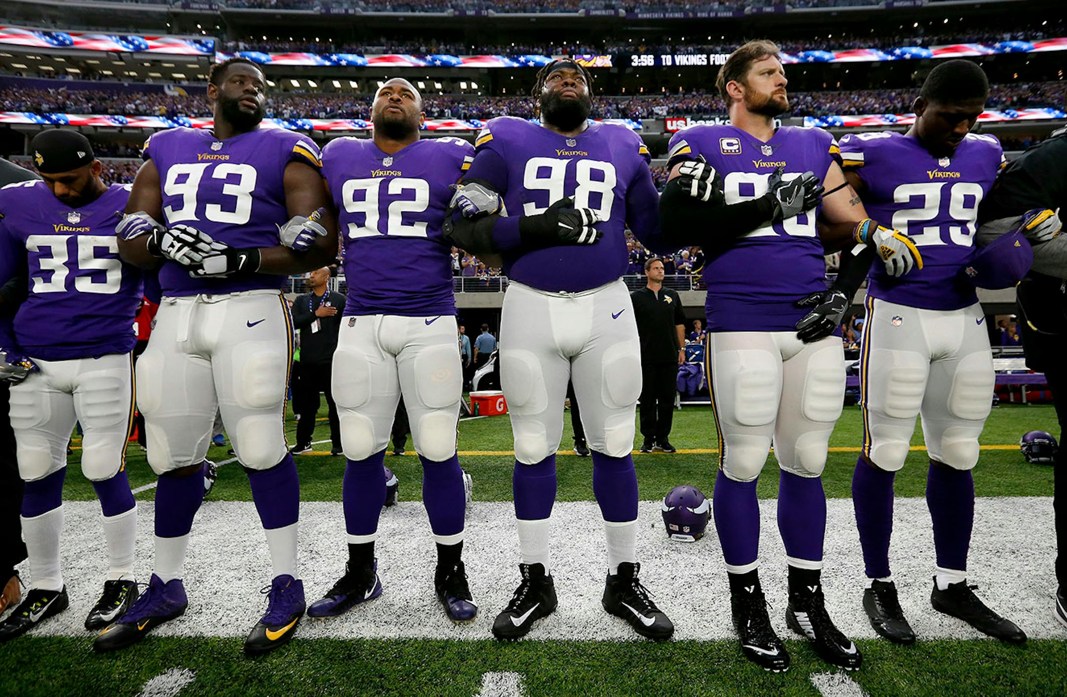Minnesota Vikings players joined arms during the National Anthem before the start of the game.