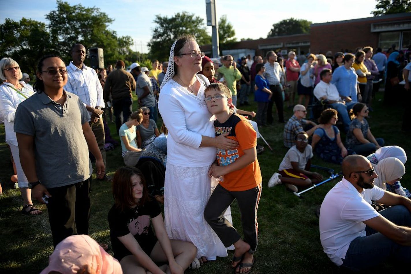 Angela Evans and her 8- year-old son, Anton, drove in from New Germany to attend Tuesday's support rally at Dar Al Farooq Islamic Center in Bloomington.