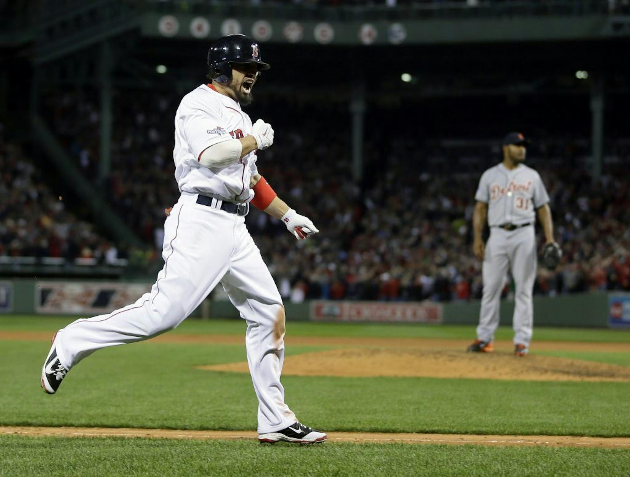 Boston Red Sox's Shane Victorino, left, celebrates his grand slam off Detroit Tigers relief pitcher Jose Veras, right, as he heads toward home in the seventh inning during Game 6 of the American League baseball championship series on Saturday, Oct. 19, 2013, in Boston.