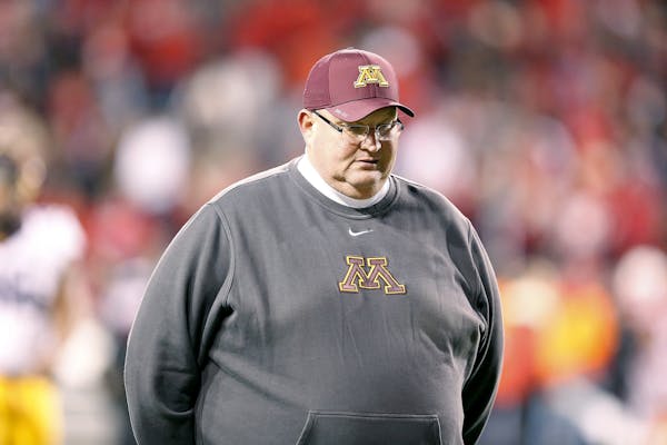 Minnesota's head coach Tracy Claeys made his way off the field after their 24-17 loss to Nebraska at Tom Osborne Field at Memorial Stadium, Saturday, 