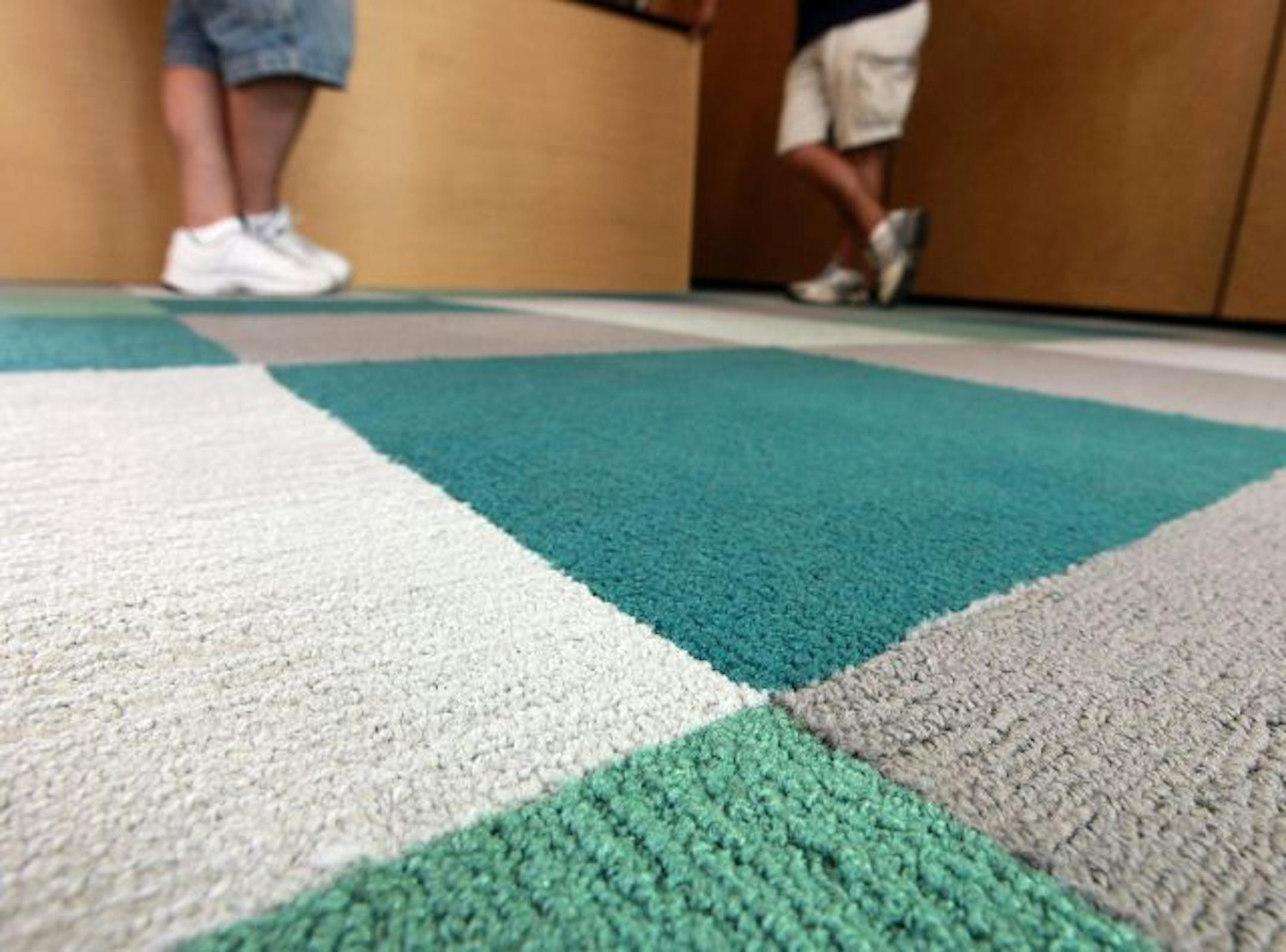 Below right: Square carpet panels easily swap out if damaged, and they're recycled every time — old carpet becomes new carpet.