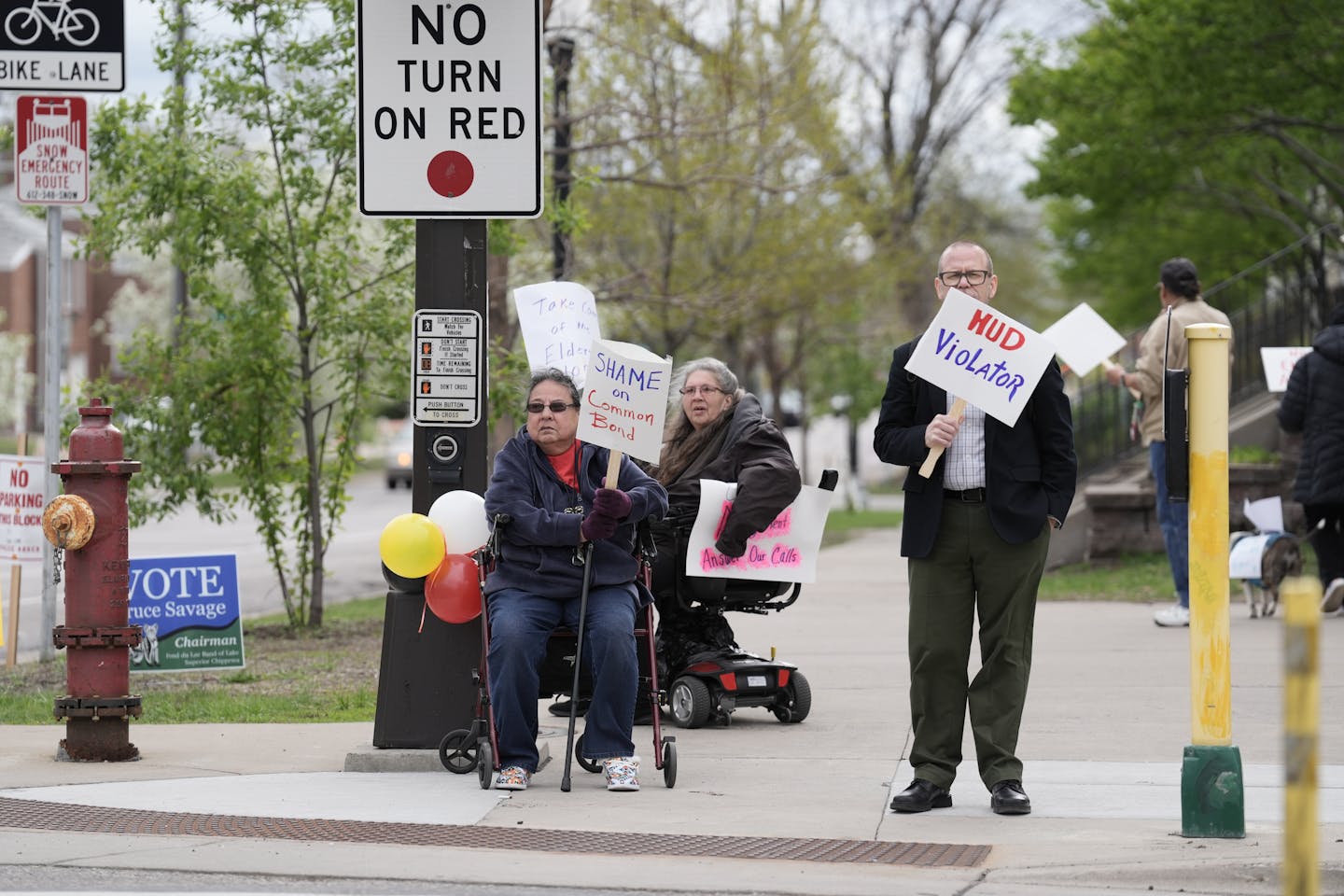 Charlene Toal (left) protests conditions at her senior apartment, Bii Di Gain in south Minneapolis. Toal and other residents have been complaining for