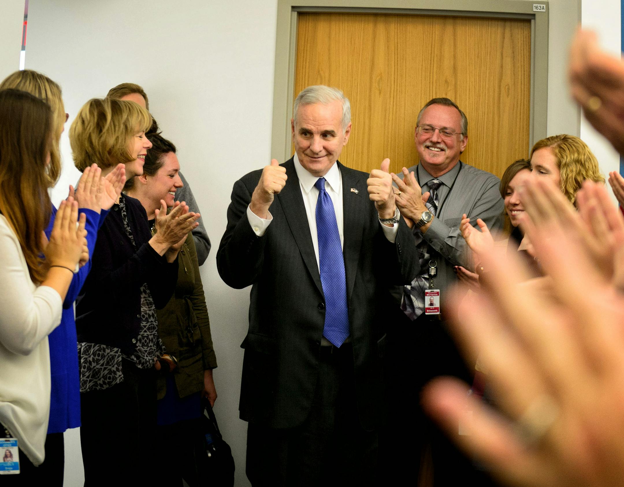 Governor Mark Dayton and Lt. Governor Elect Tina Smith received a rousing round of applause from staffers as they arrived at their offices near the State Capitol after winning the election . ] GLEN STUBBE * gstubbe@startribune.com Wednesday, November 5, 2014