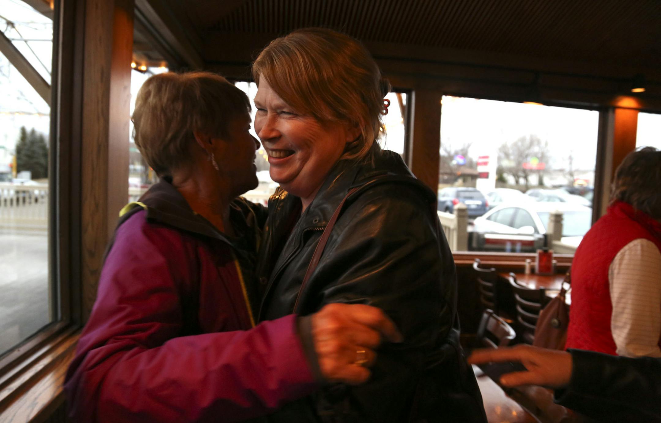 Karen Wiczec, left, hugged VIckie Eklund at the end of a monthly meeting of "The Sunshine Girls" at The Sunshine Factory, a wildly popular neighborhood restaurant in New Hope, Min., Tuesday, April 9, 2013.This group has been meeting for more than 15 years at this place. The restaurant plans to move a few miles west from its present location this summer. ] (KYNDELL HARKNESS/STAR TRIBUNE) kyndell.harkness@startribune.com