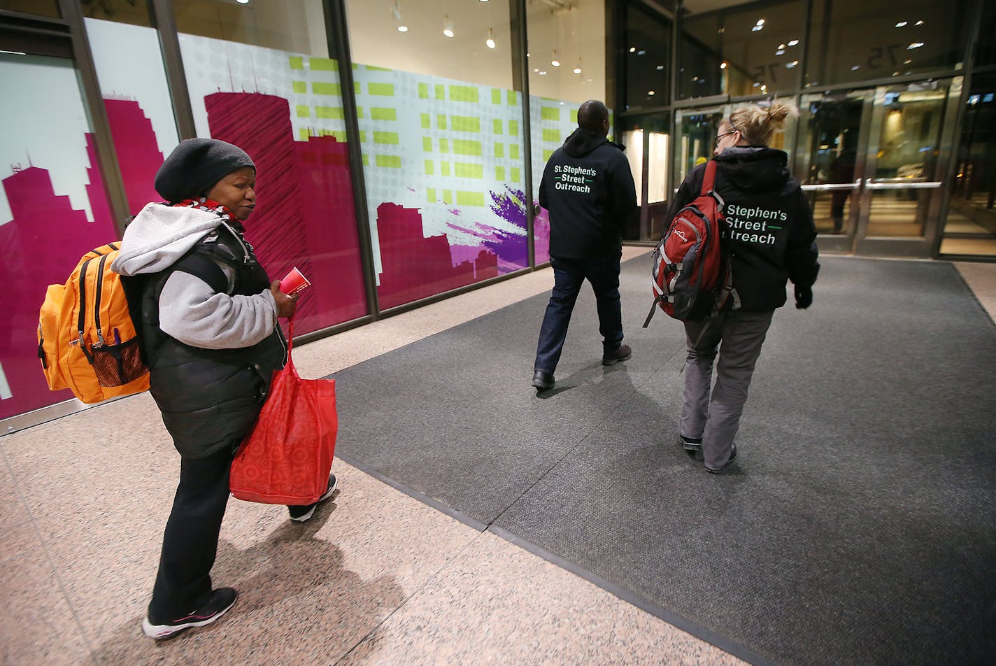 an outreach worker from St. Stephen's Human Services, led Donna to their car to give her socks and other items after she spent the night on the rail system early Thursday, January 28, 2015 in Minneapolis, MN. ] (ELIZABETH FLORES/STAR TRIBUNE) ELIZABETH FLORES &#x2022; eflores@startribune.com