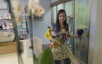 Ashley Weed owner of Jandrich Floral Shop worked on a flower arrangement Thursday July 5, 2018 in St. Paul, MN.