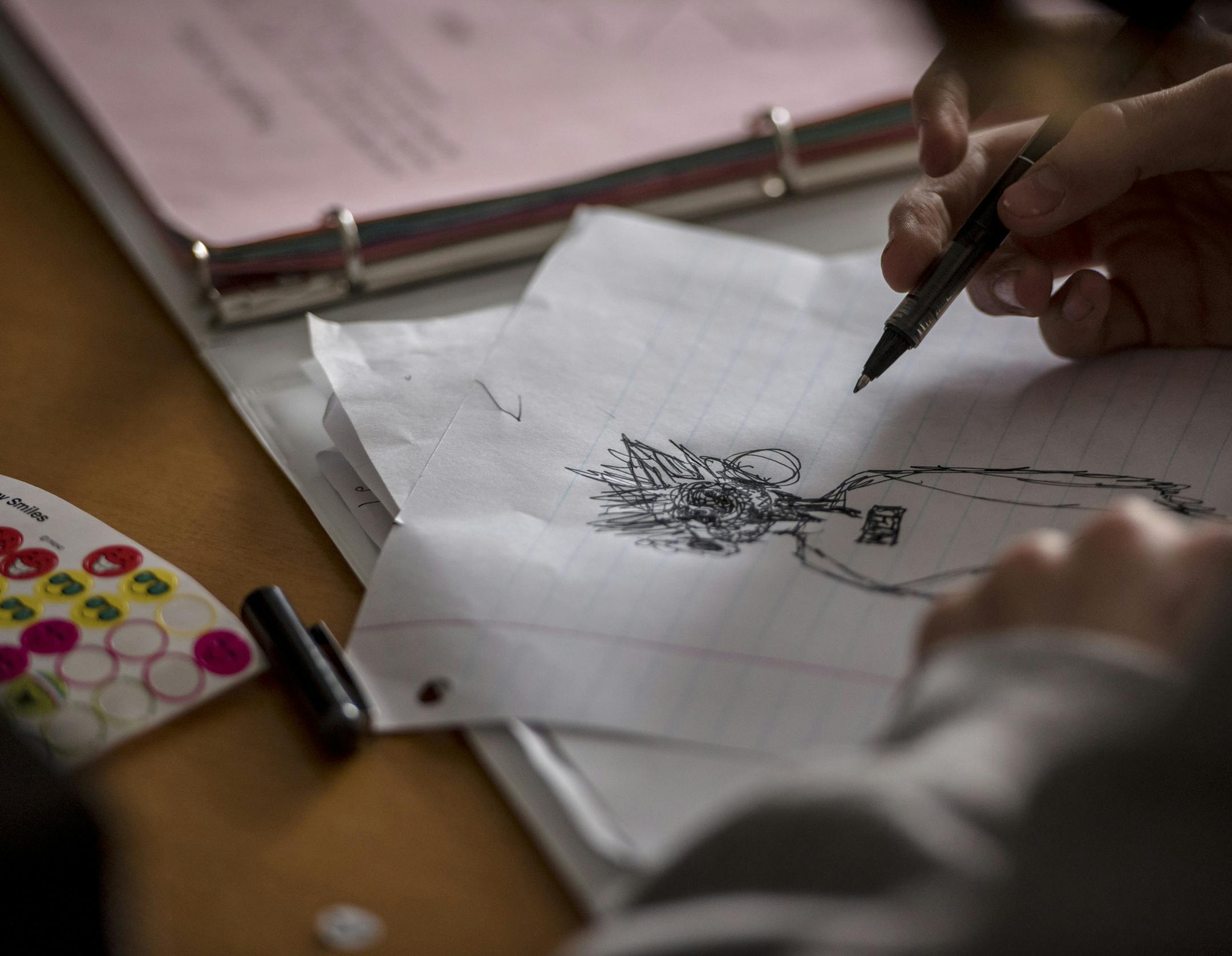 A student draws during an intensive therapy program taught by Avital Falk at Weill Cornell Medicine in New York, April 9, 2018. Advocates say short-term, concentrated programs like the one Falk leads can bring relief more quickly and don’t give patients time to unlearn what they have been taught. (Hilary Swift/The New York Times)