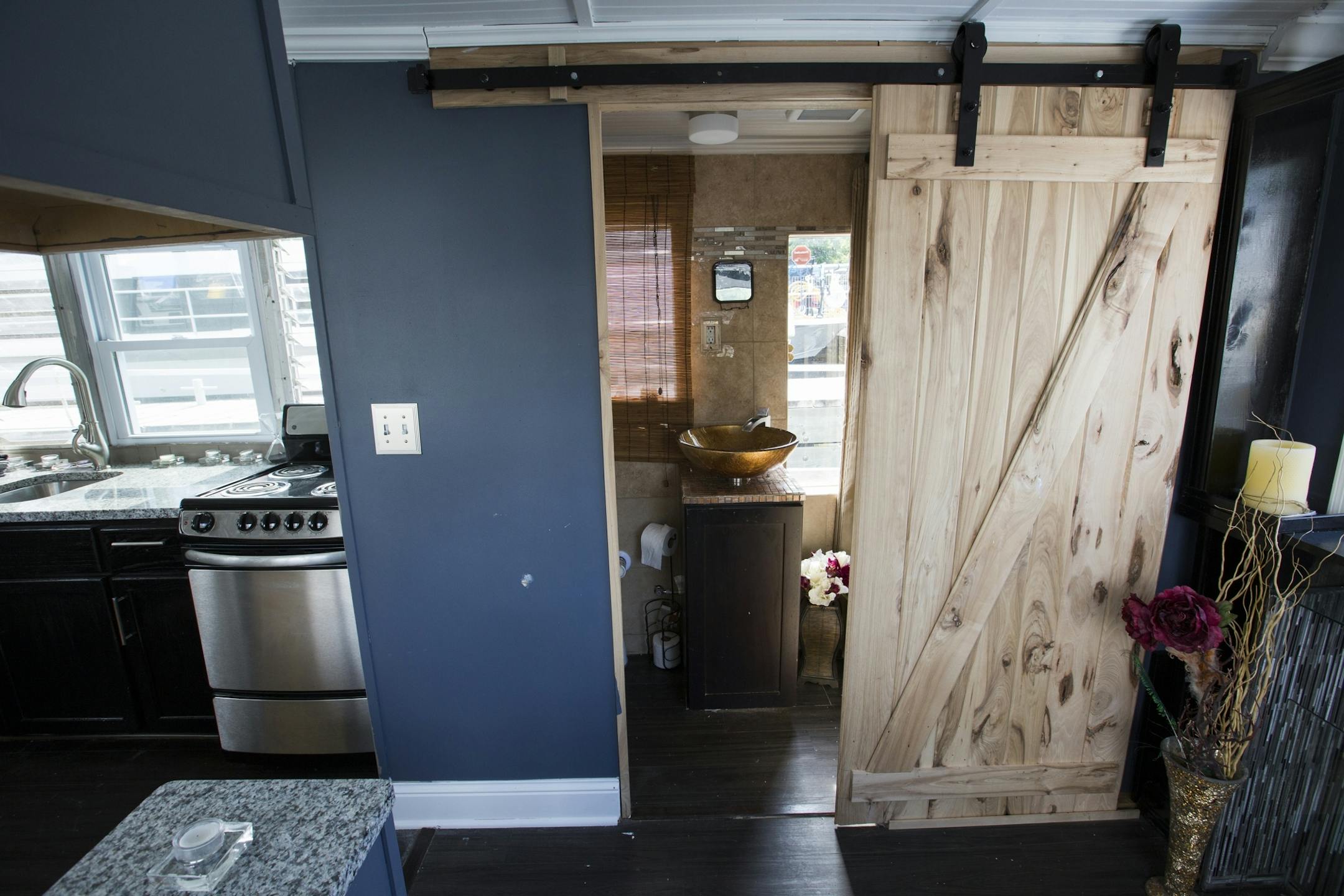 The new bathroom has a barn-style door.