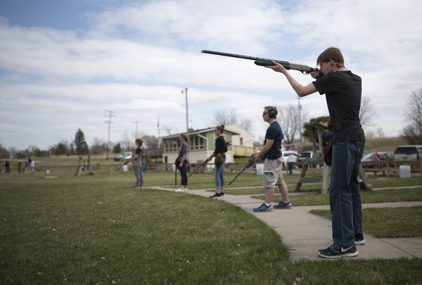 Jack Sueker, a freshman at Wayzata and varsity shooter, aims and fires at a clay pigeon during practice on Thursday afternoon. ] (Aaron Lavinsky | StarTribune) aaron.lavinsky@startribune.com Photos to accompany an Outdoors Weekend story about the wild popularity of high school trapshooting teams in Minnesota. The Wayzata clay target league team was photographed on Thursday, April 16, 2015 at the Park Sportsmens Club in Wayzata.