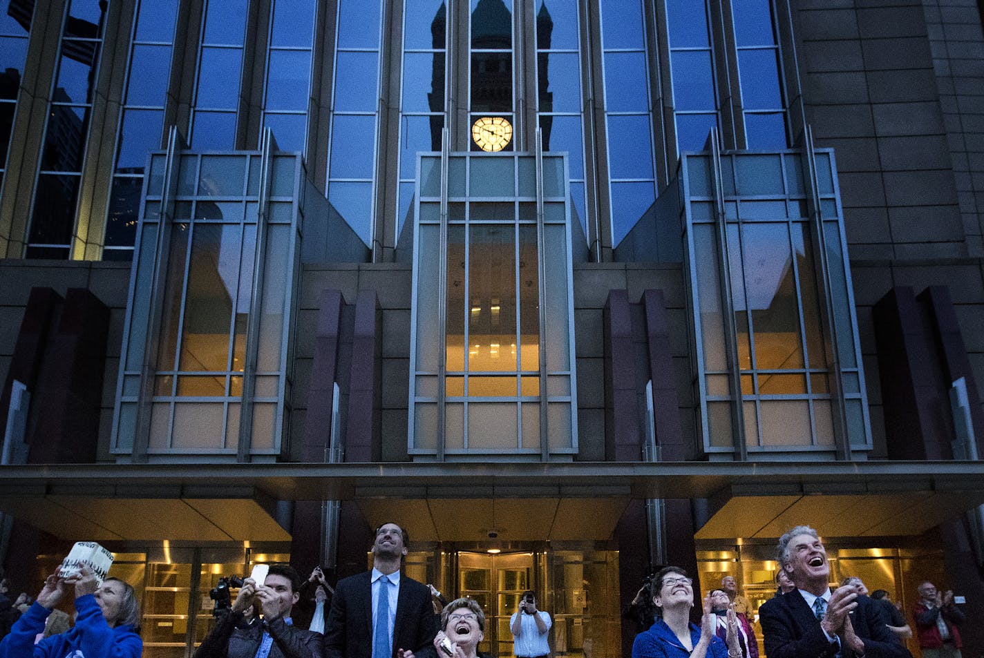 Minneapolis City Council President Barb Johnson (right) Hennepin County Commissioner Jan Callison (second from right) and Commissioner Peter McLaughlin (right) applauded after the lighting of the clock at Minneapolis City Hall. ] CARLOS GONZALEZ &#xef; cgonzalez@startribune.com - April 24, 2017, Minneapolis, MN, Minneapolis City Hall Clock Lighting Ceremony