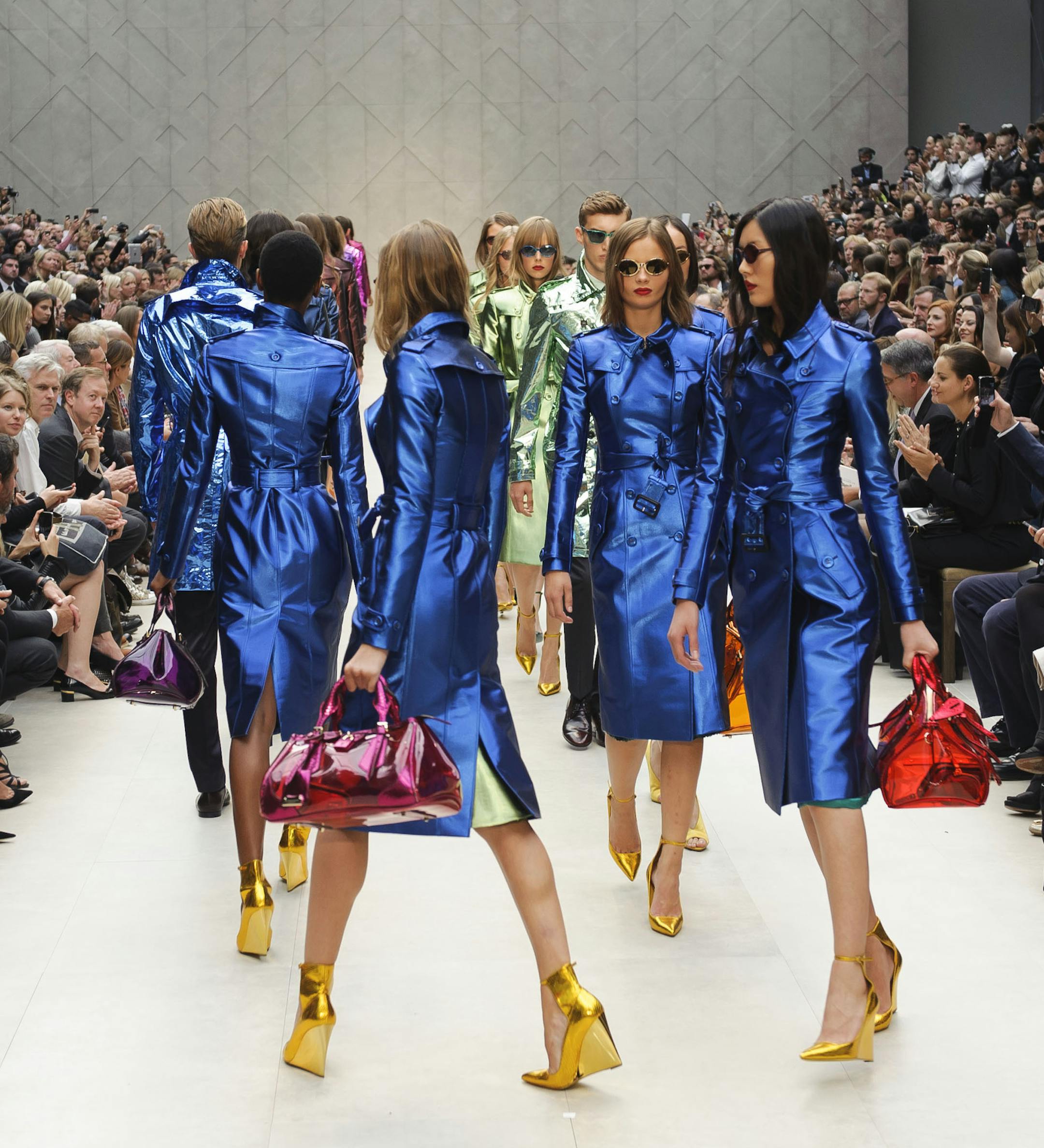 Models display designs from Burberry Prorsum's Spring/Summer 2013 collection, in Kensington, west London, during London Fashion Week, Monday Sept. 17, 2012. (AP Photo/Jonathan Short) ORG XMIT: MIN2012091810514928