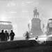 Double-decker buses circle the Prince Albert statue at Holborn Circus in London, England, in the smog at night on Dec. 6, 1952. The heavy smog, caused