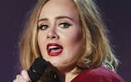 FILE - In this Feb. 24, 2016 file photo shows Adele onstage at the Brit Awards 2016 at the 02 Arena in London. The Recording Academy announced Friday,