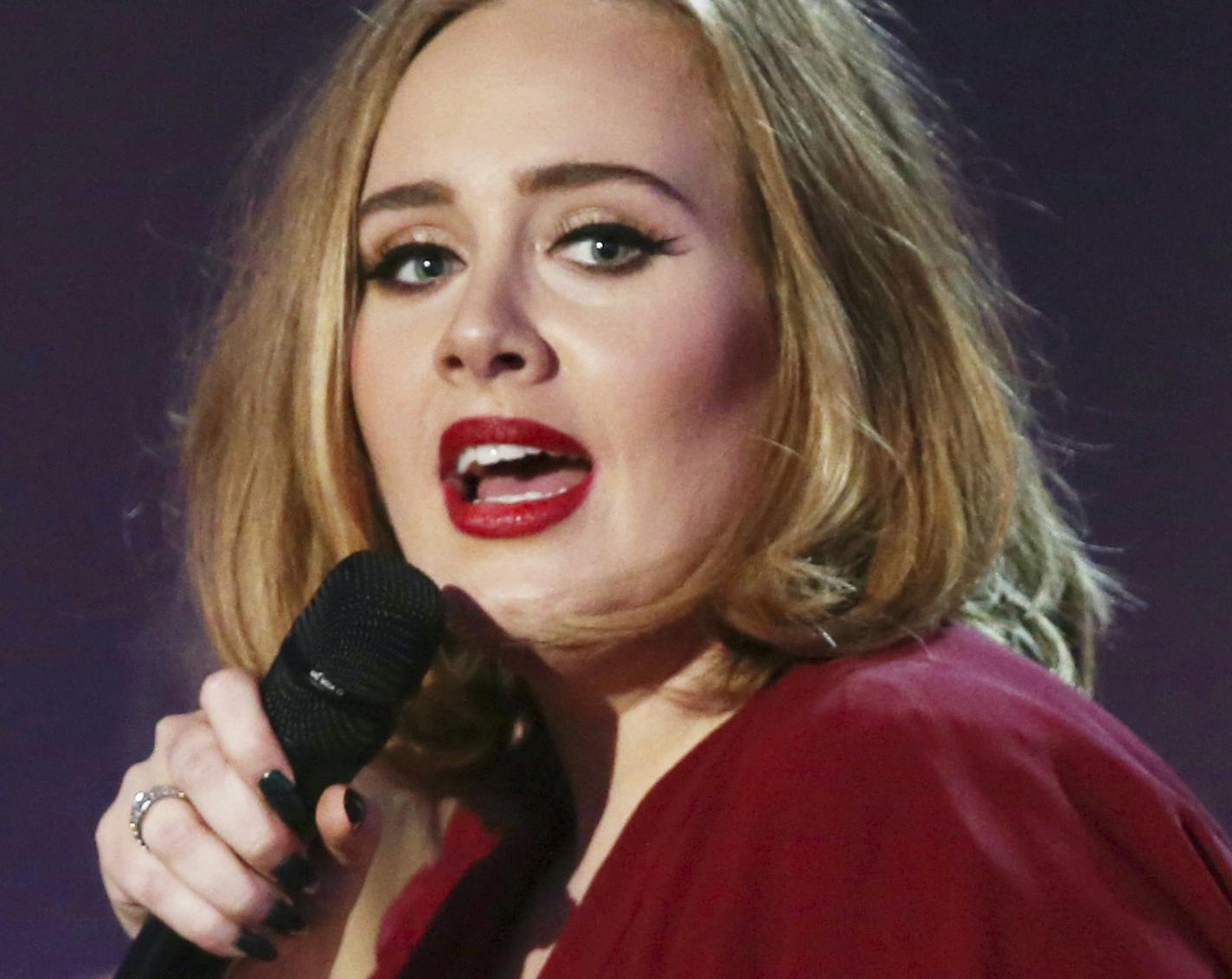 FILE - In this Feb. 24, 2016 file photo shows Adele onstage at the Brit Awards 2016 at the 02 Arena in London. The Recording Academy announced Friday, Jan. 20, 2017, that Adele will perform at the Feb. 12 show at the Staples Center in Los Angeles. Previously announced performers include Metallica, Carrie Underwood, John Legend and Keith Urban.(Photo by Joel Ryan/Invision/AP, File)