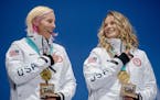 U.S. skiers Kikkan Randall, left, and Jessie Diggins of Afton, Minn., after winning the gold in the team sprint in Pyeonchang, South Korea, on Thursda