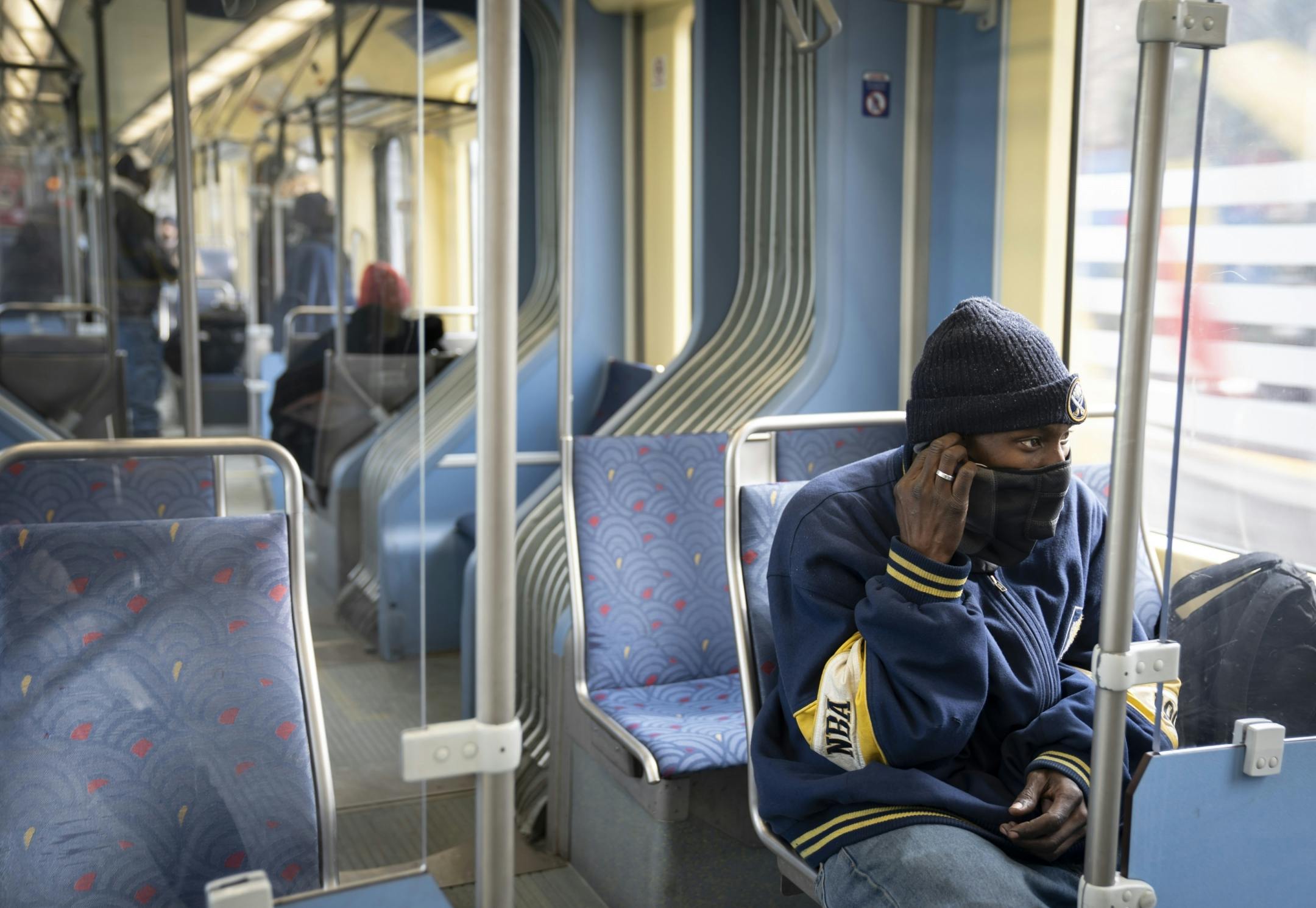 Larry Dorrough listened to music as he rode an almost empty Light Rail train during the P.M. rush hour in Minneapolis, Minn., on Monday, April 13, 2020.