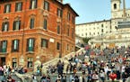 rome, latium, italy - March 6. 2007: romans and tourists sit on the spanish steps in rome, italy,
