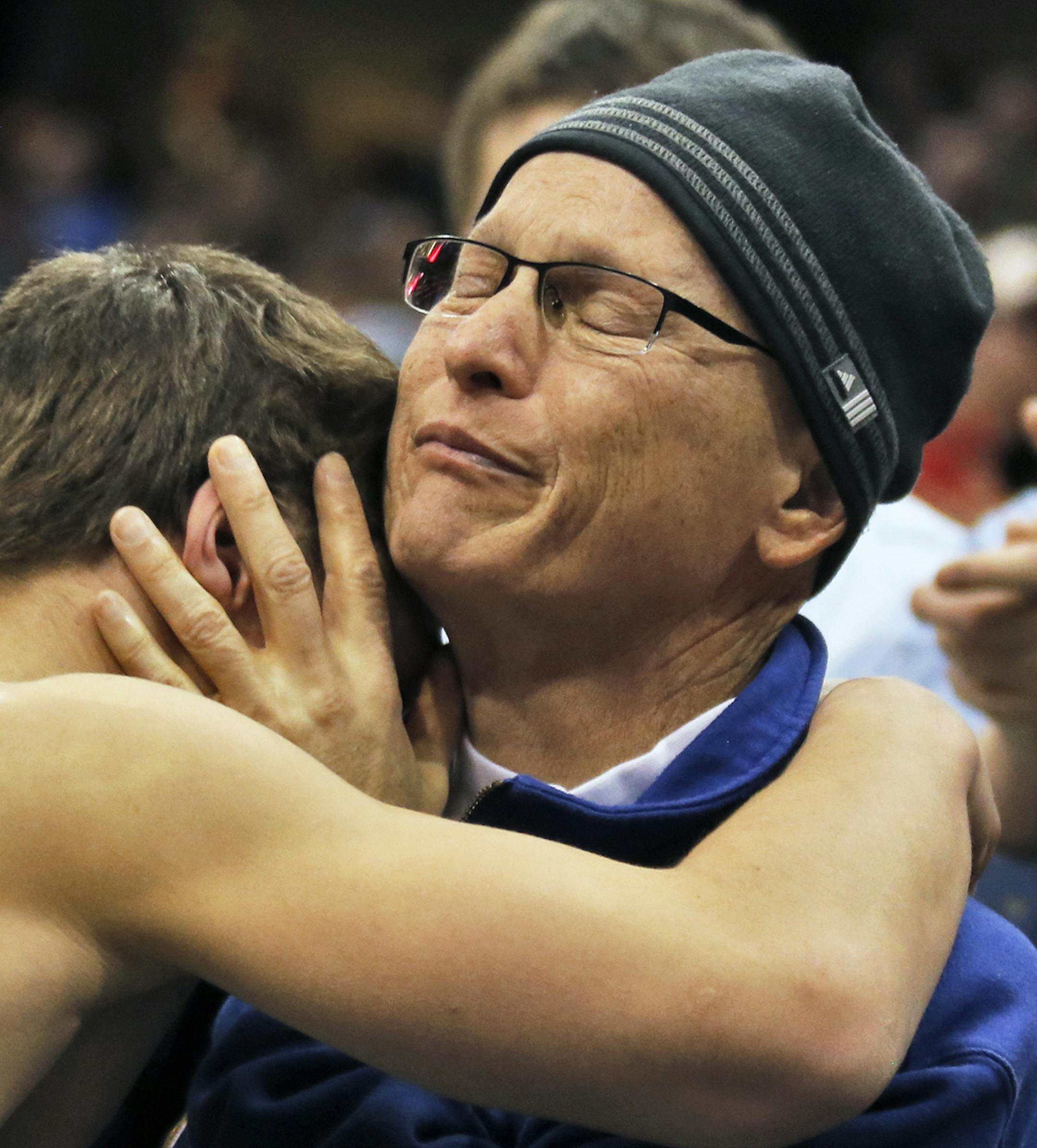 Mitchell McKee of St. Michael-Albertville hugged his dad Steve McKee after winning the 3A 120lb championship match. Steve McKee left a hospital bed where he is under going treatment for cancer to watch his son wrestle. [ Prep State Wrestling Individual Championships (MARLIN LEVISON/STARTRIBUNE(mlevison@startribune.com)