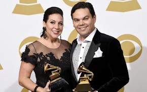 Kristen Anderson-Lopez, left, and Robert Lopez pose in the press room with the awards for best compilation soundtrack for visual media and best song w